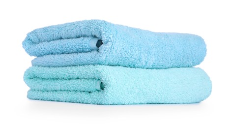 Photo of Stack of colorful terry towels isolated on white