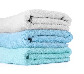 Photo of Stack of colorful terry towels isolated on white