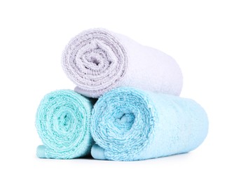 Photo of Stack of rolled terry towels isolated on white