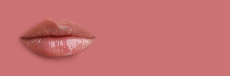 Image of Woman's lips against background matching color of her lipstick. Banner design with space for text