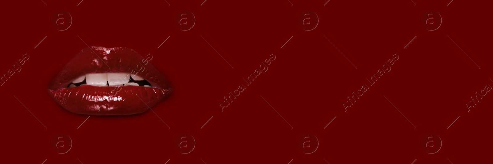 Woman's lips against background matching color of her lipstick. Banner design with space for text Image of Woman's lips against background matching color of her lipstick. Banner design with space for text