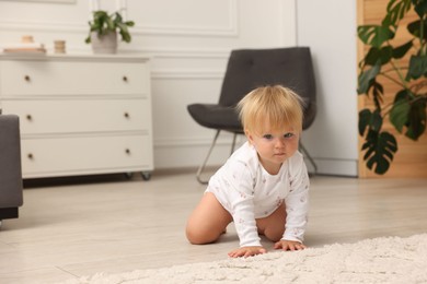 Photo of Cute baby on floor at home. Space for text