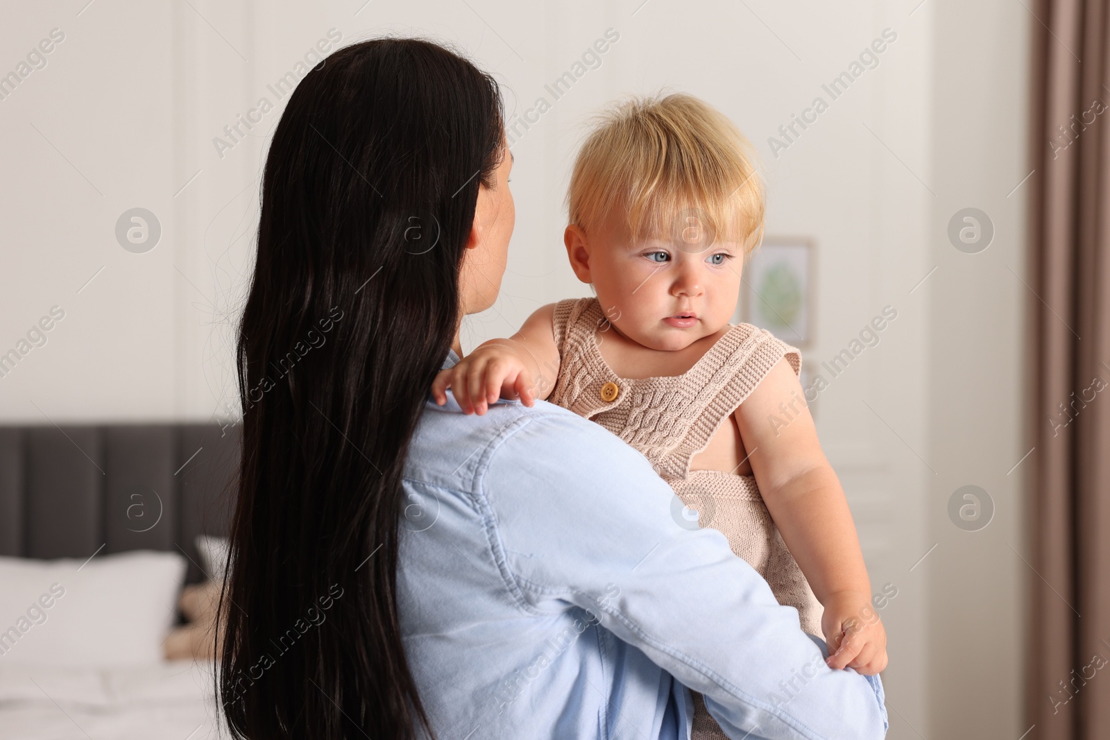 Photo of Cute baby with her mother at home