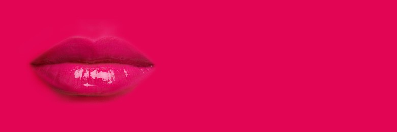 Image of Woman's lips against background matching color of her lipstick. Banner design with space for text
