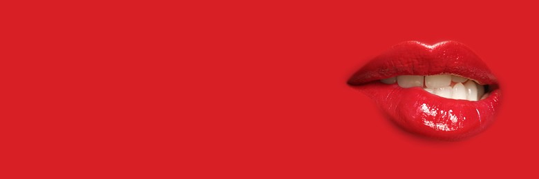 Image of Woman's lips against background matching color of her lipstick. Banner design with space for text