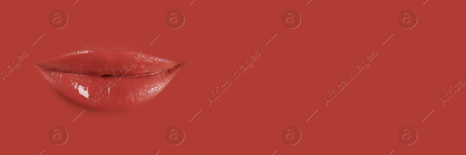 Woman's lips against background matching color of her lipstick. Banner design with space for text Image of Woman's lips against background matching color of her lipstick. Banner design with space for text