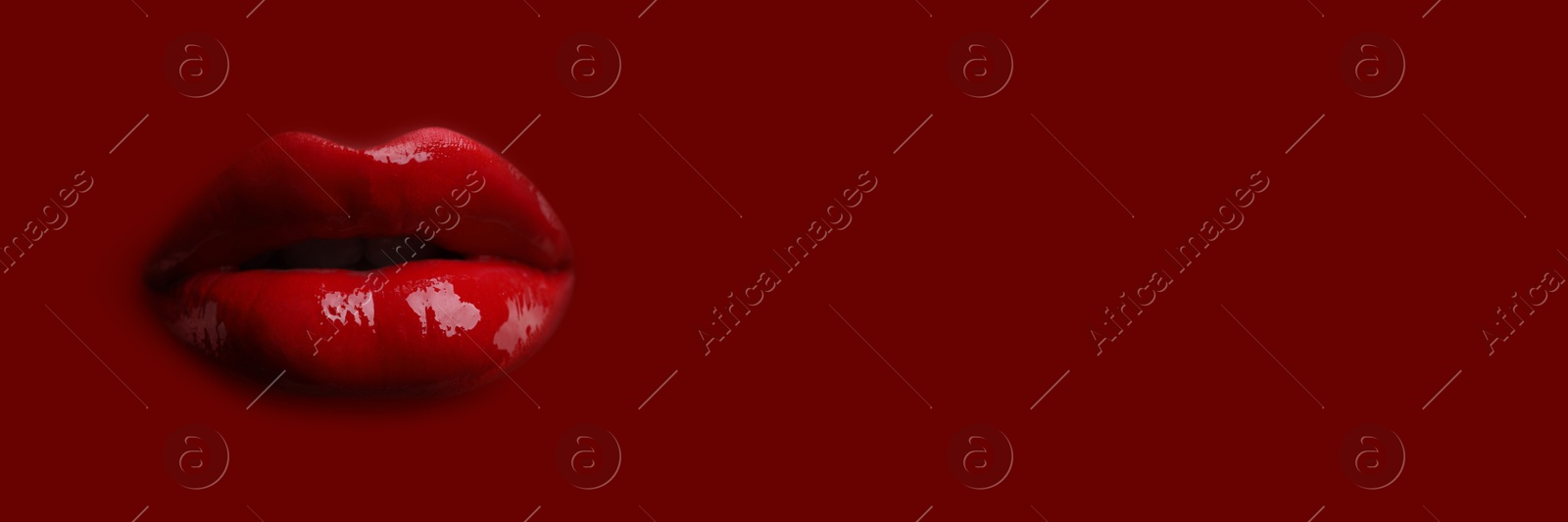 Woman's lips against background matching color of her lipstick. Banner design with space for text Image of Woman's lips against background matching color of her lipstick. Banner design with space for text