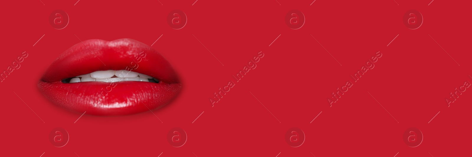 Woman's lips against background matching color of her lipstick. Banner design with space for text Image of Woman's lips against background matching color of her lipstick. Banner design with space for text