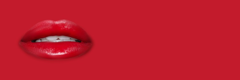 Image of Woman's lips against background matching color of her lipstick. Banner design with space for text