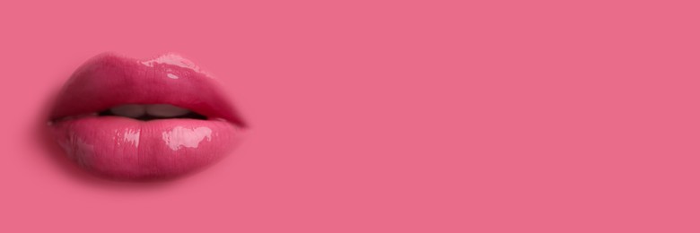 Image of Woman's lips against background matching color of her lipstick. Banner design with space for text