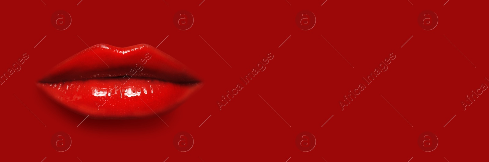Woman's lips against background matching color of her lipstick. Banner design with space for text Image of Woman's lips against background matching color of her lipstick. Banner design with space for text