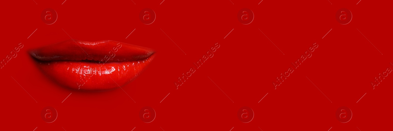 Woman's lips against background matching color of her lipstick. Banner design with space for text Image of Woman's lips against background matching color of her lipstick. Banner design with space for text