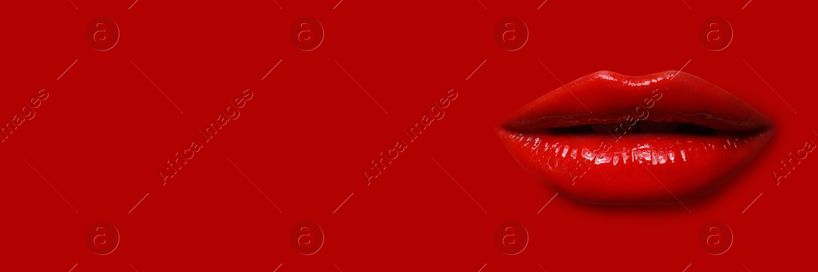 Woman's lips against background matching color of her lipstick. Banner design with space for text Image of Woman's lips against background matching color of her lipstick. Banner design with space for text