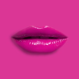 Image of Woman's lips against background matching color of her lipstick