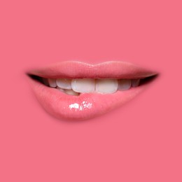 Image of Woman's lips against background matching color of her lipstick