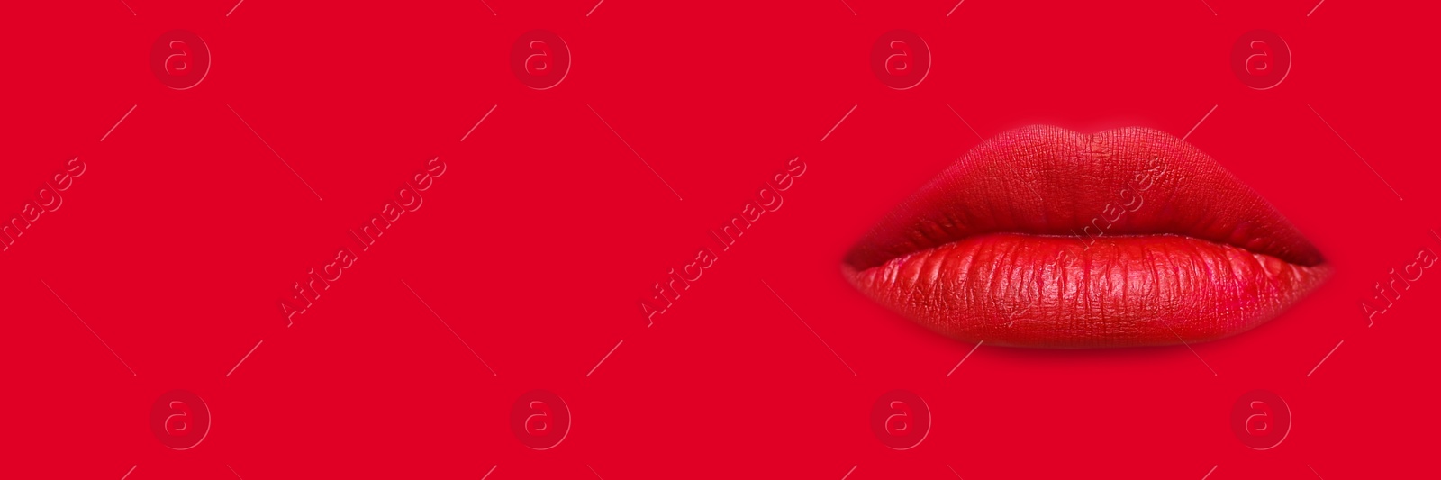 Woman's lips against background matching color of her lipstick. Banner design with space for text Image of Woman's lips against background matching color of her lipstick. Banner design with space for text