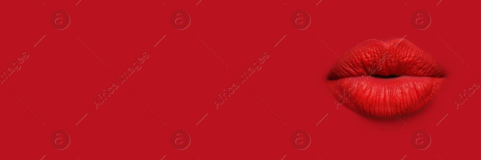 Woman's lips against background matching color of her lipstick. Banner design with space for text Image of Woman's lips against background matching color of her lipstick. Banner design with space for text