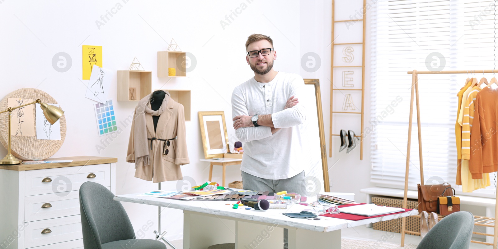 Fashion designer in his studio, banner design. Creating stylish clothes Image of Fashion designer in his studio, banner design. Creating stylish clothes