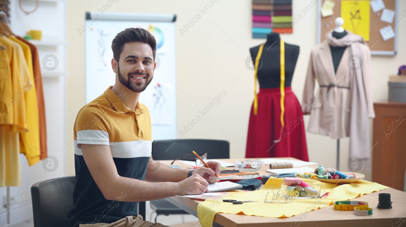 Image of Fashion designer working in studio, banner design. Creating stylish clothes