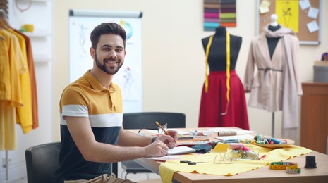 Image of Fashion designer working in studio, banner design. Creating stylish clothes