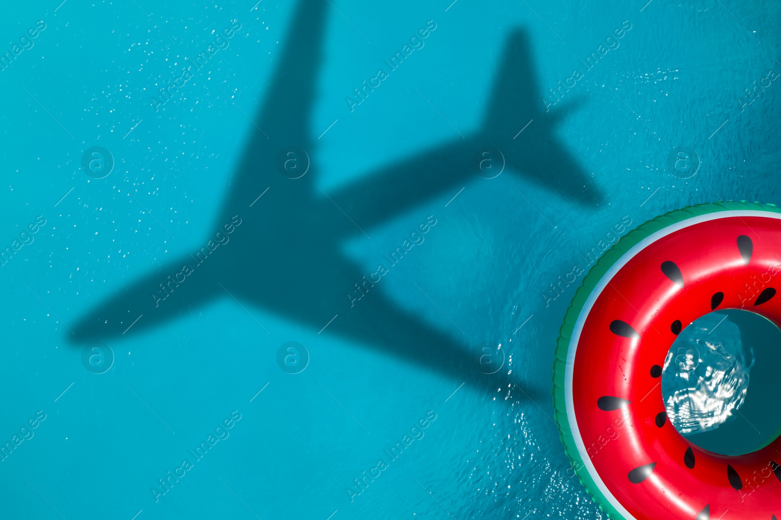 Inflatable ring floating in swimming pool, top view. Flying airplane casting shadow on water Image of Inflatable ring floating in swimming pool, top view. Flying airplane casting shadow on water
