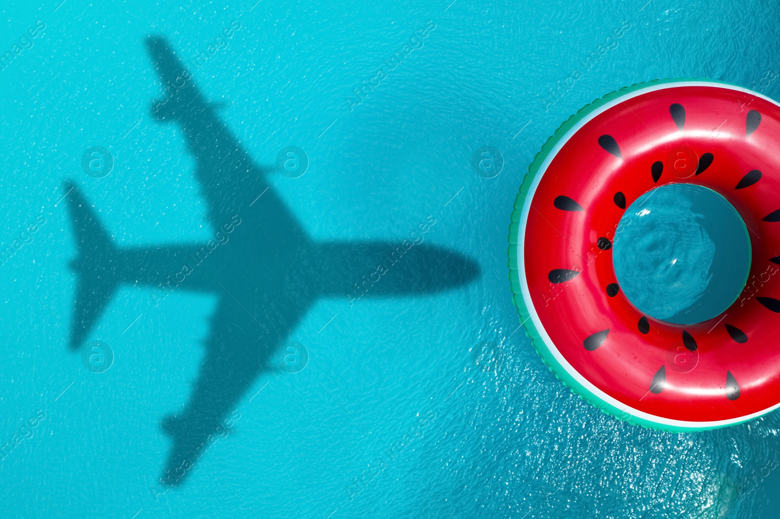 Inflatable ring floating in swimming pool, top view. Flying airplane casting shadow on water Image of Inflatable ring floating in swimming pool, top view. Flying airplane casting shadow on water