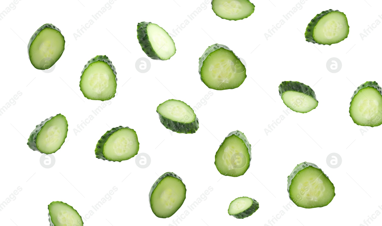 Pieces of fresh cucumbers falling on white background Image of Pieces of fresh cucumbers falling on white background