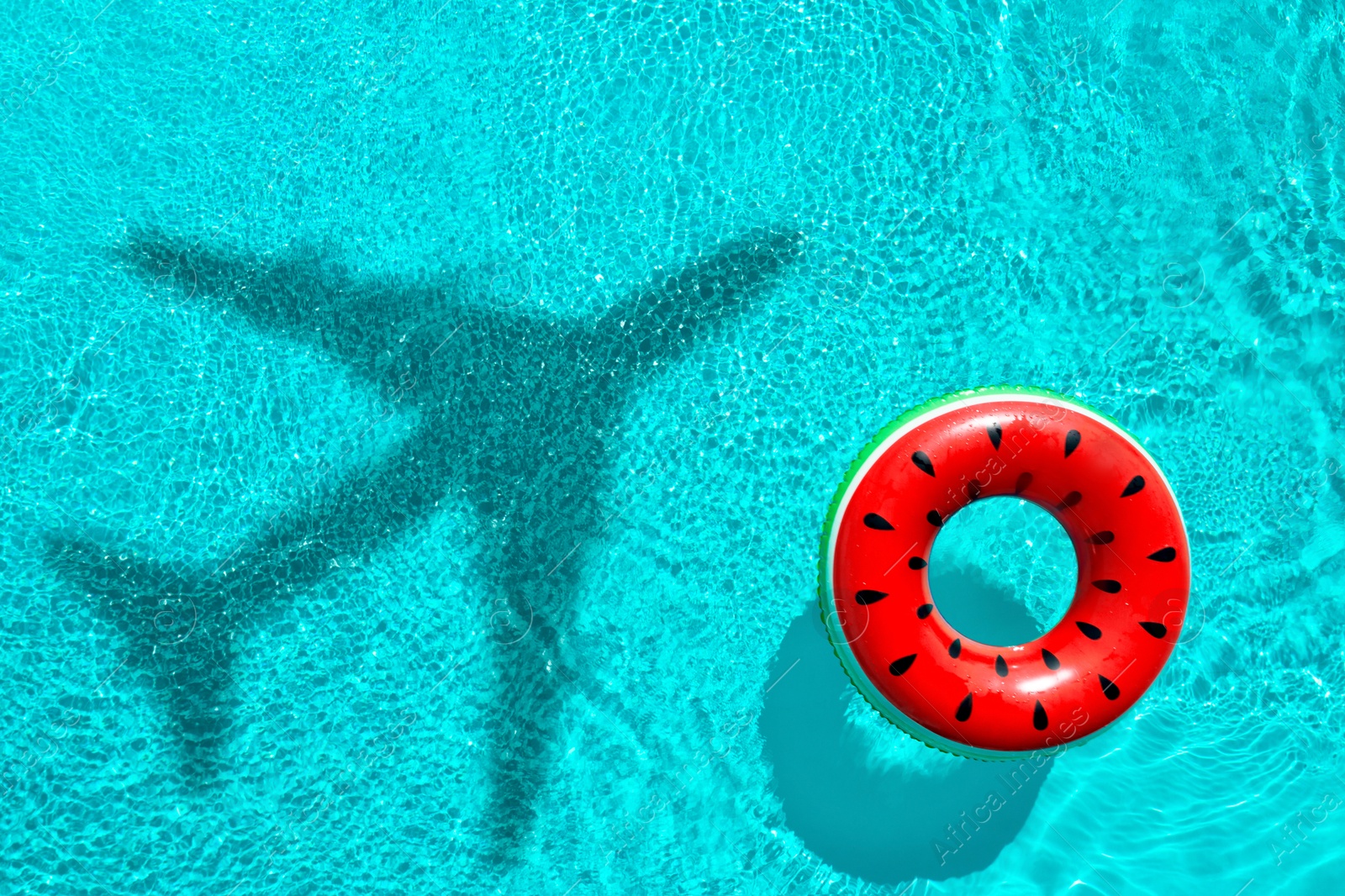 Inflatable ring floating in swimming pool, top view. Flying airplane casting shadow on water Image of Inflatable ring floating in swimming pool, top view. Flying airplane casting shadow on water