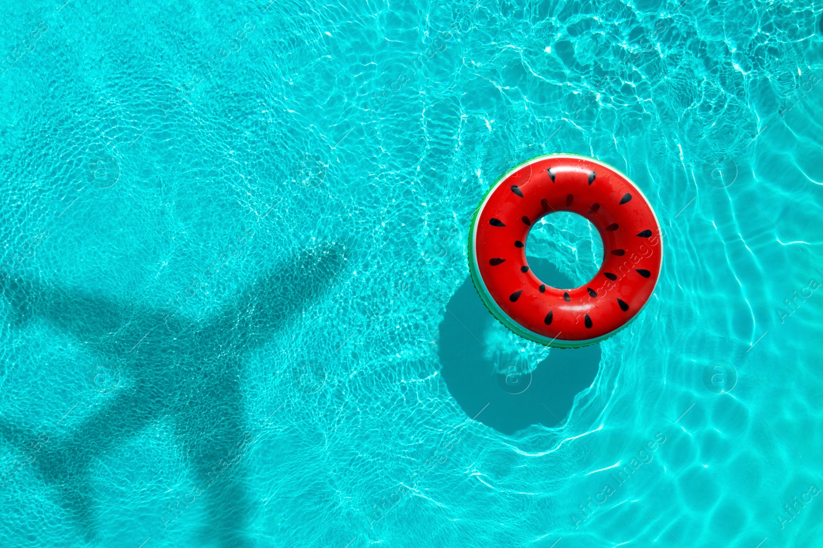 Inflatable ring floating in swimming pool, top view. Flying airplane casting shadow on water Image of Inflatable ring floating in swimming pool, top view. Flying airplane casting shadow on water