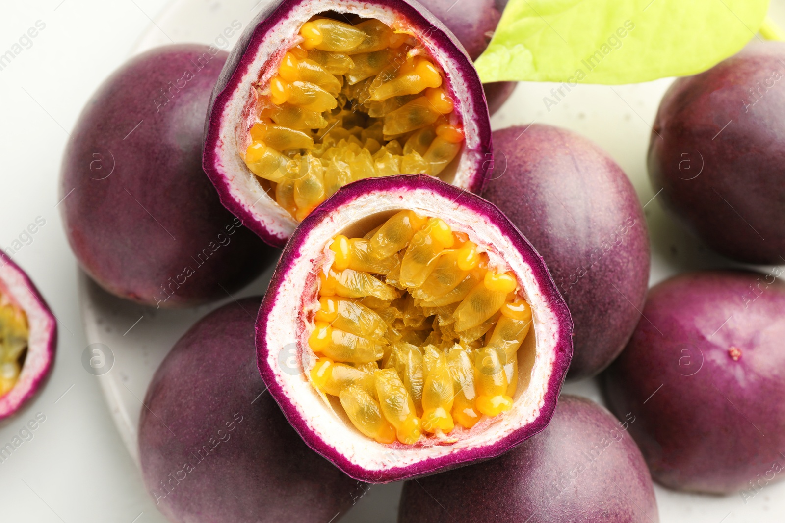 Fresh passion fruits on white table, closeup Photo of Fresh passion fruits on white table, closeup