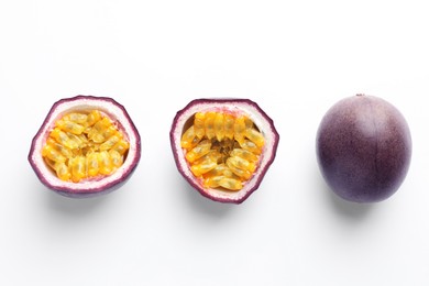 Photo of Fresh passion fruits on white background, top view. Whole and cut