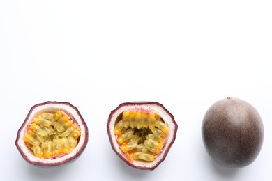 Photo of Fresh passion fruits on white background, top view. Space for text