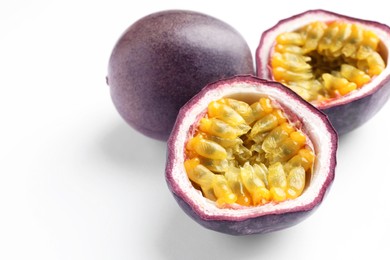 Photo of Fresh passion fruits on white background, closeup
