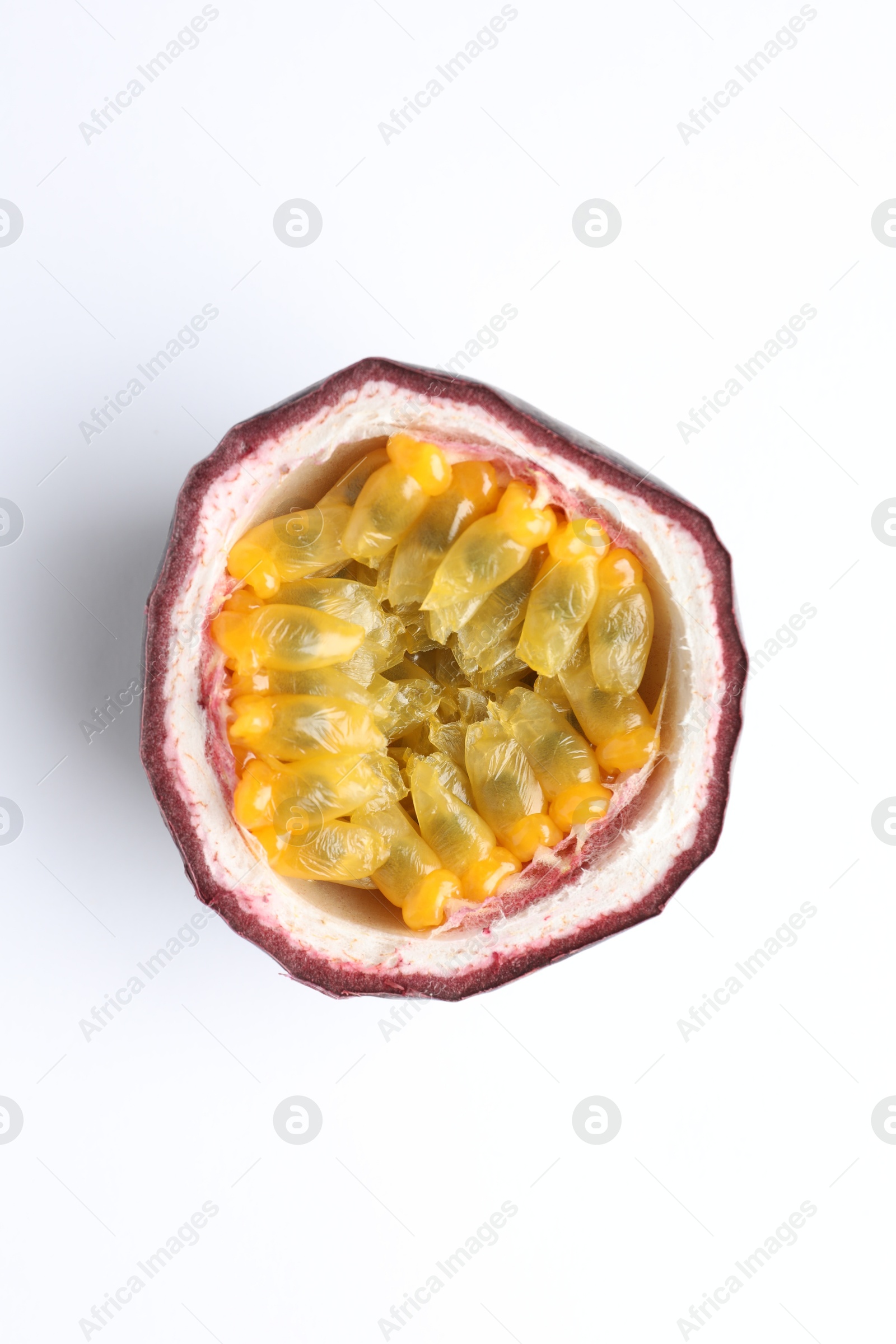 Photo of Half of fresh passion fruit on white background, top view
