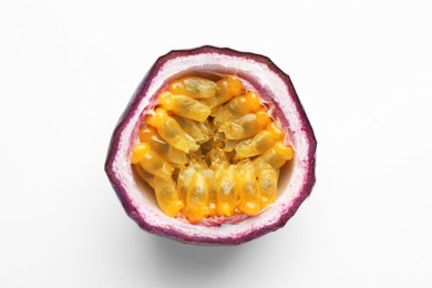 Photo of Half of fresh passion fruit on white background, closeup