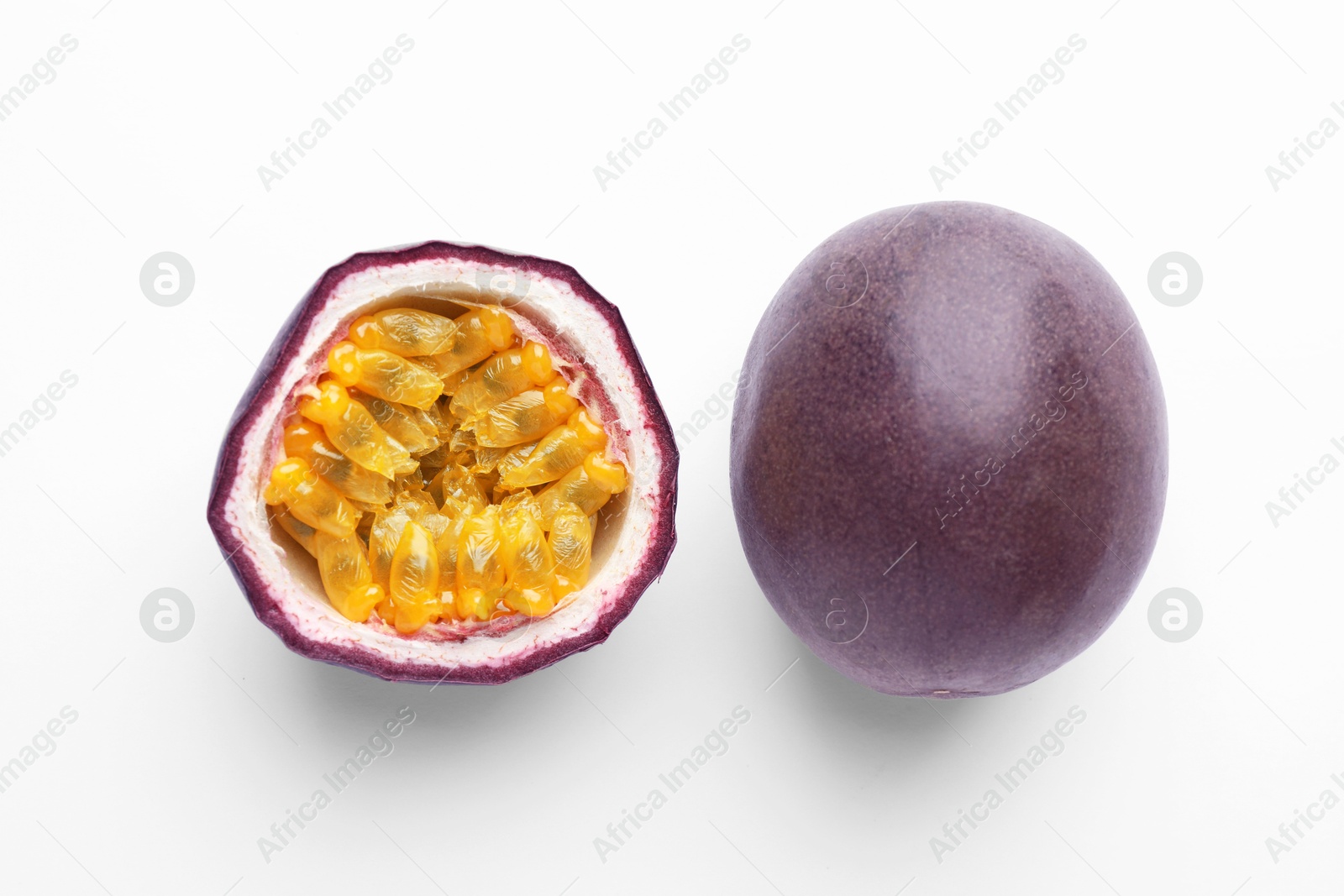 Photo of Fresh passion fruits on white background, above view. Whole and cut