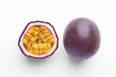 Photo of Fresh passion fruits on white background, above view. Whole and cut