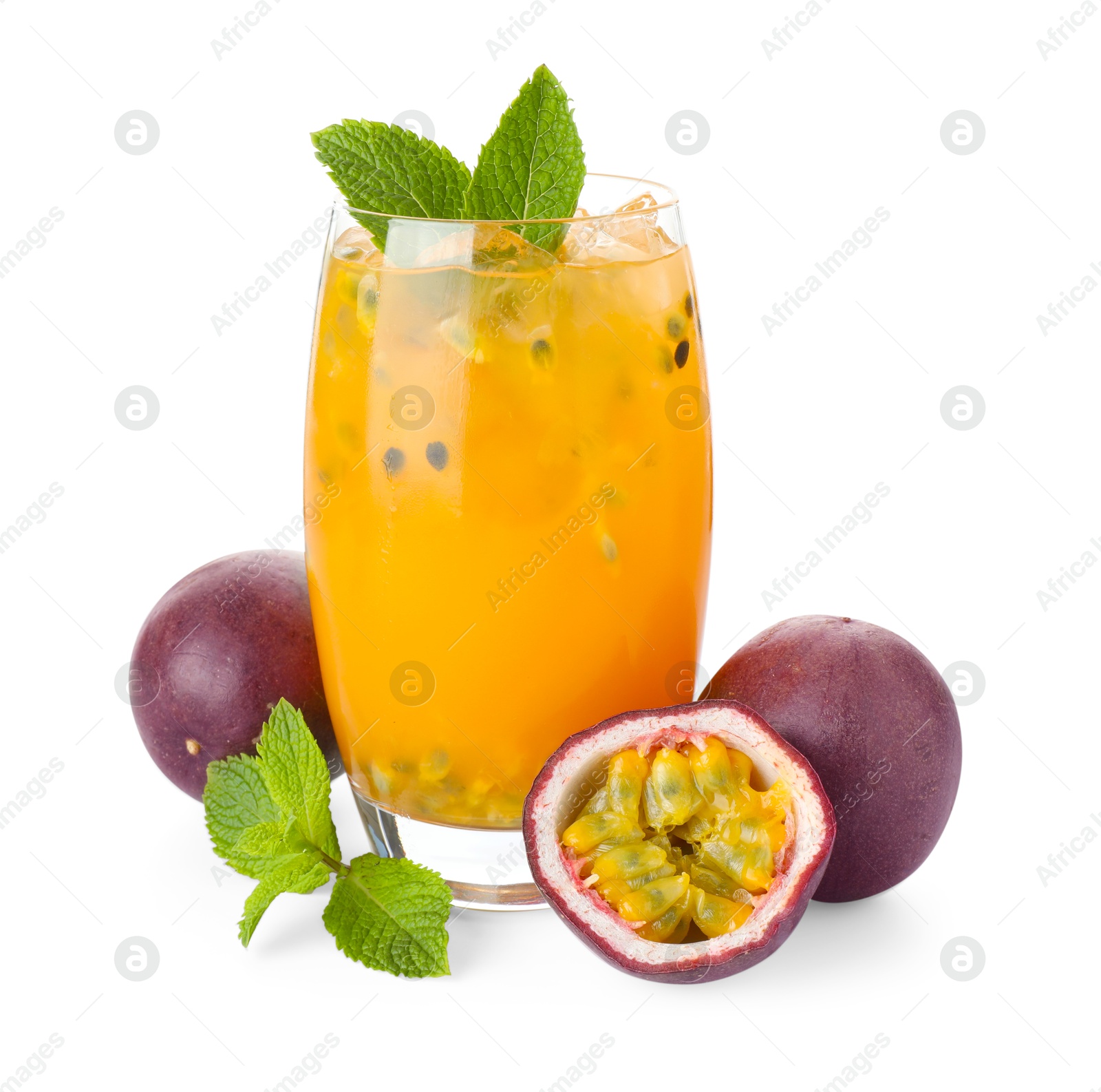 Photo of Tasty passion fruit drink with mint in glass and fresh fruits isolated on white