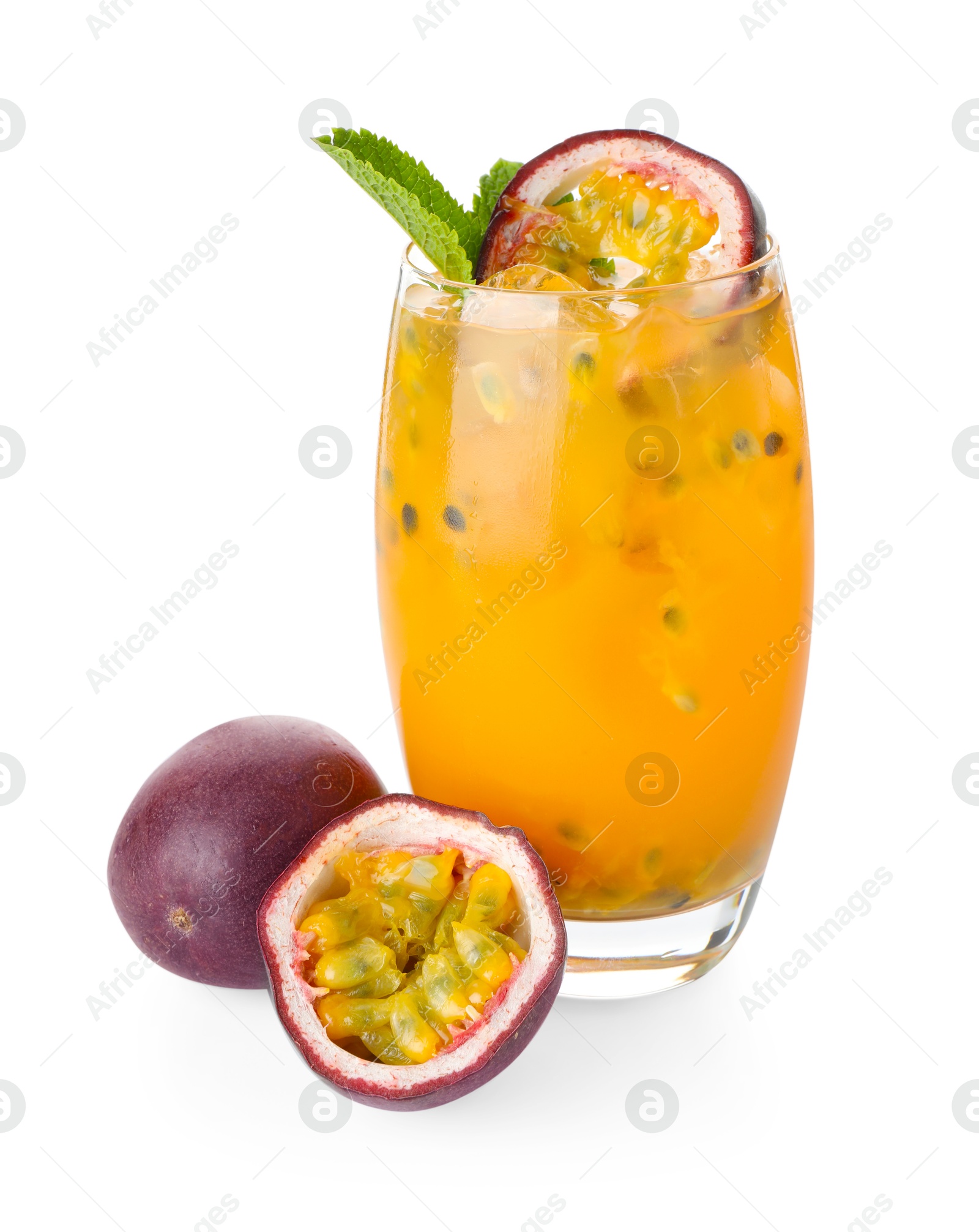 Photo of Tasty passion fruit drink with mint in glass and fresh fruits isolated on white