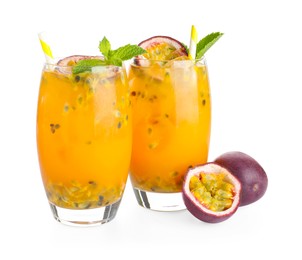 Photo of Tasty passion fruit drink with mint in glasses and fresh fruits isolated on white