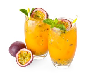 Photo of Tasty passion fruit drink with mint in glasses and fresh fruits isolated on white