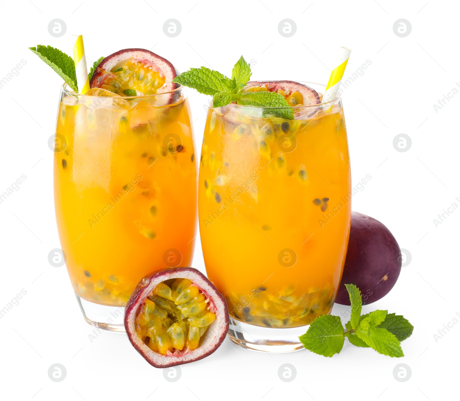 Photo of Tasty passion fruit drink with mint in glasses and fresh fruits isolated on white