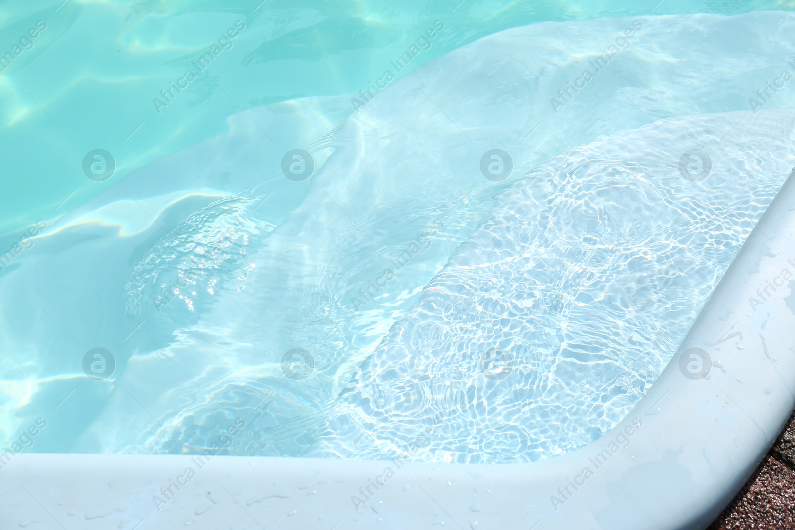 Photo of Closeup view of outdoor swimming pool on sunny day