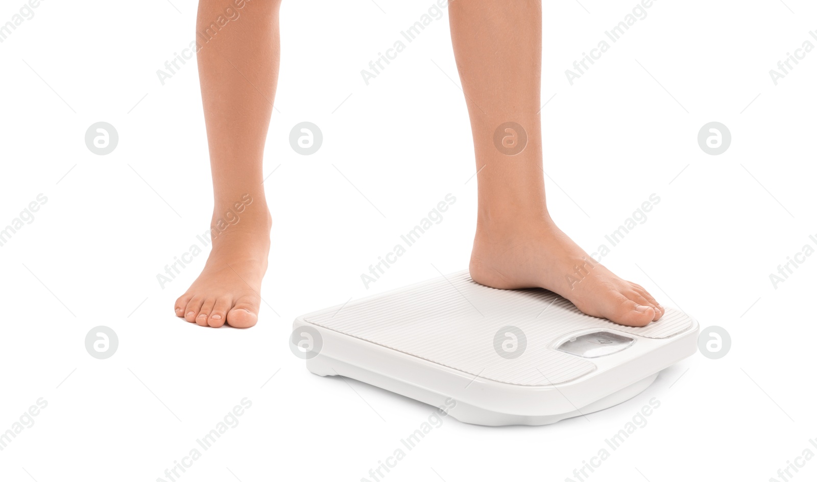 Photo of Little boy standing on scales against white background, closeup