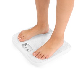 Photo of Little boy standing on scales against white background, closeup
