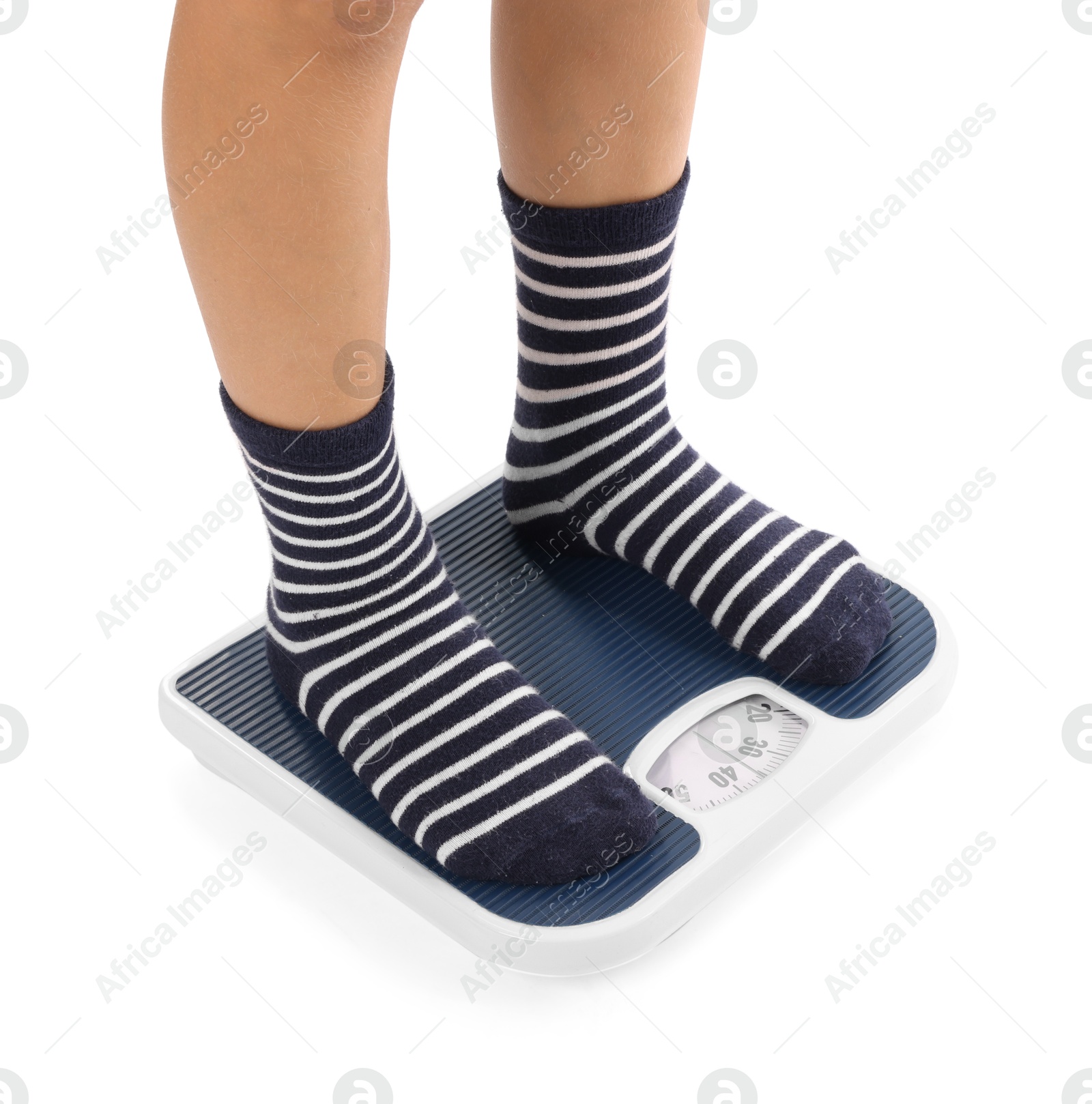 Photo of Little boy standing on scales against white background, closeup