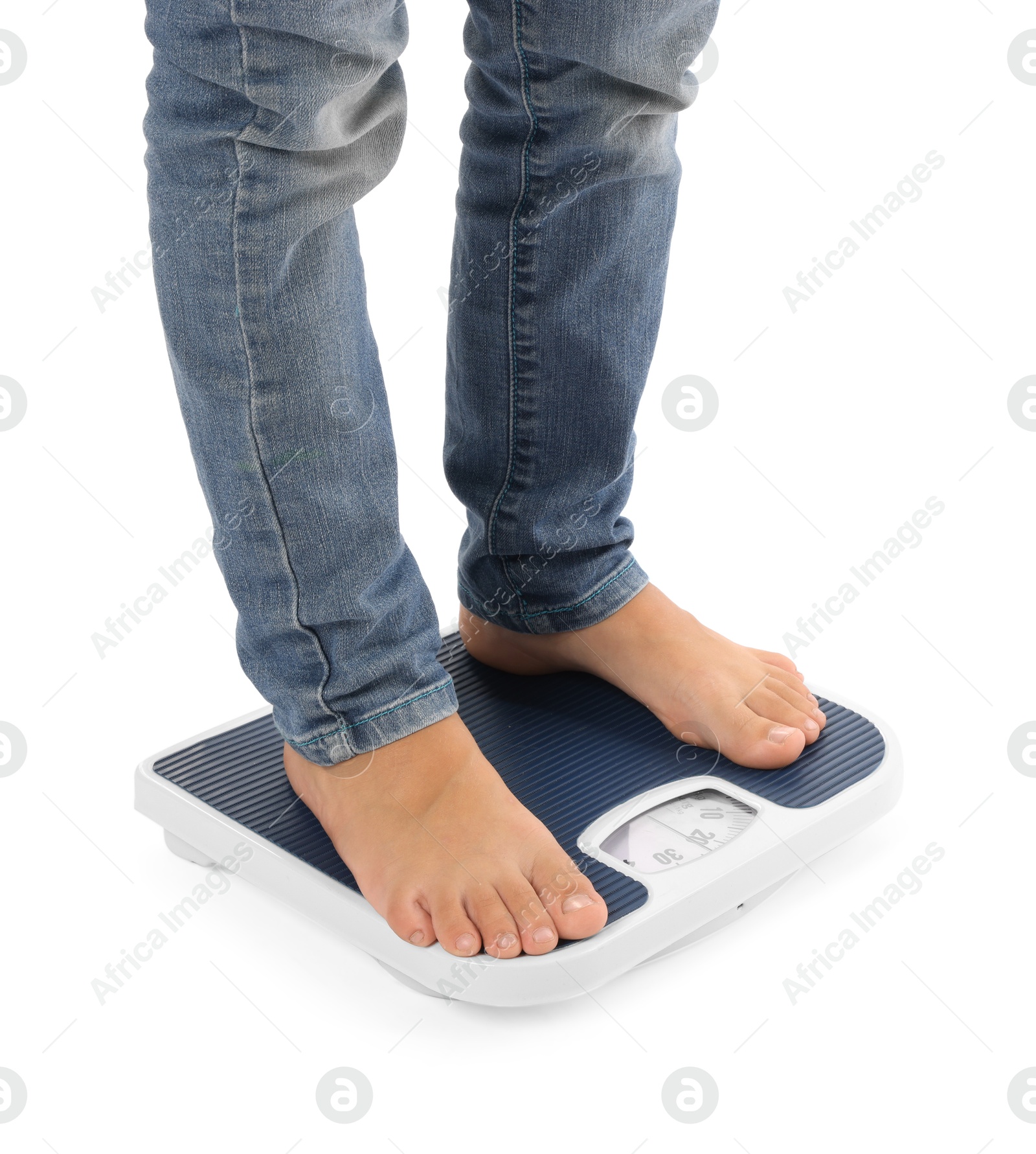 Photo of Little boy standing on scales against white background, closeup