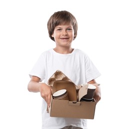 Photo of Recycling. Cute little boy with cardboard box full of different waste paper on white background