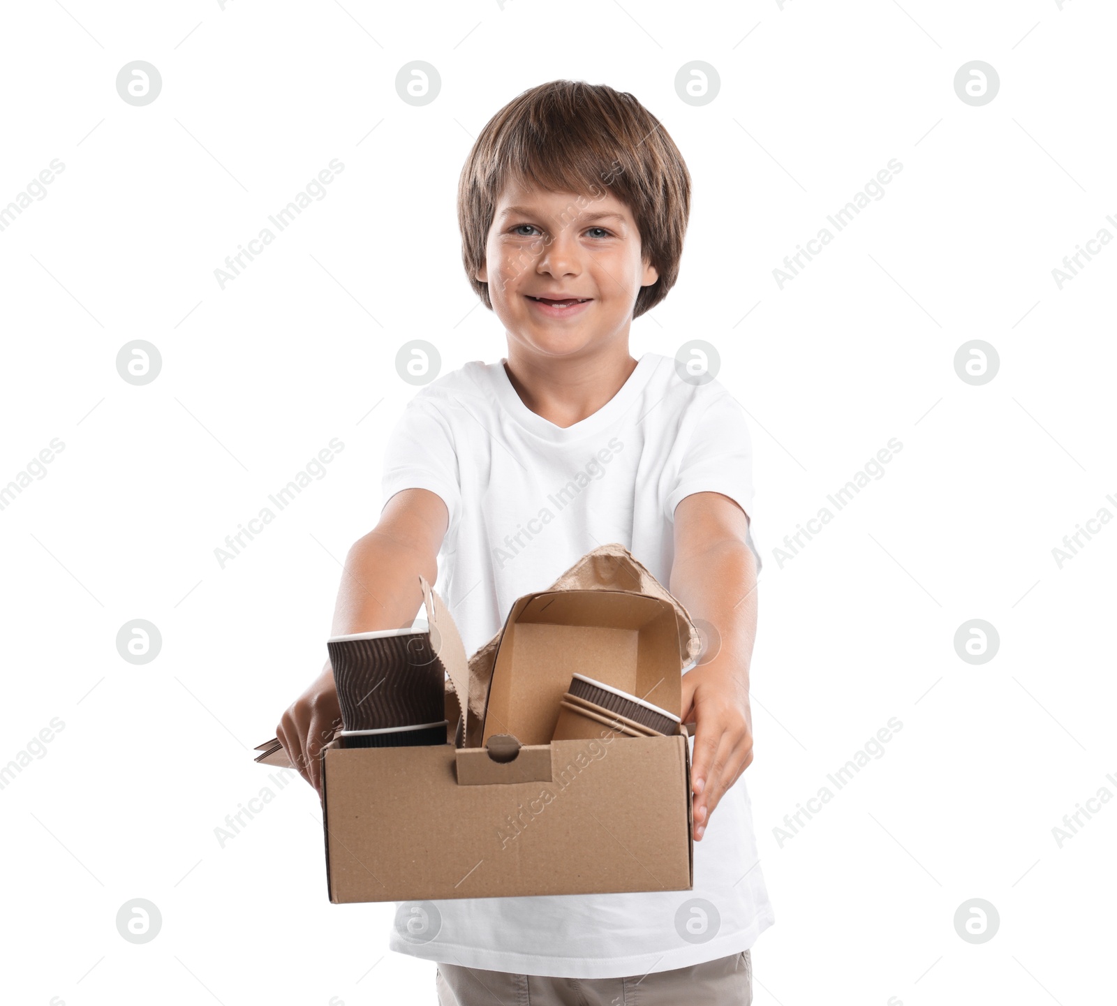 Recycling. Cute little boy with cardboard box full of different waste paper on white background Photo of Recycling. Cute little boy with cardboard box full of different waste paper on white background