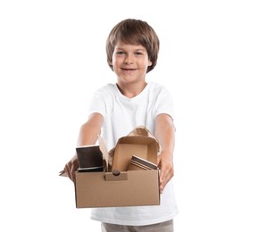 Photo of Recycling. Cute little boy with cardboard box full of different waste paper on white background